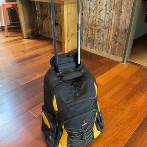 TravelPro T-Pro rolling carry-on, approved backpack.
